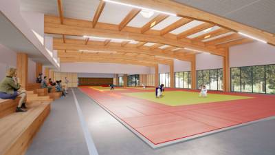 Crdit photo M-Associs Architectes : Vue sur la charpente apparente du dojo